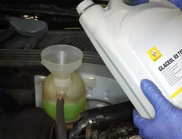 Coolant added to an expansion tank