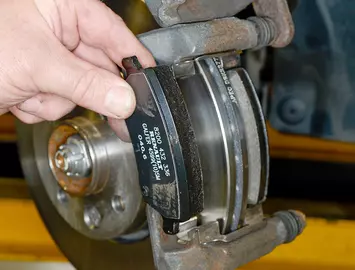 Replacing a brake pad in a caliper