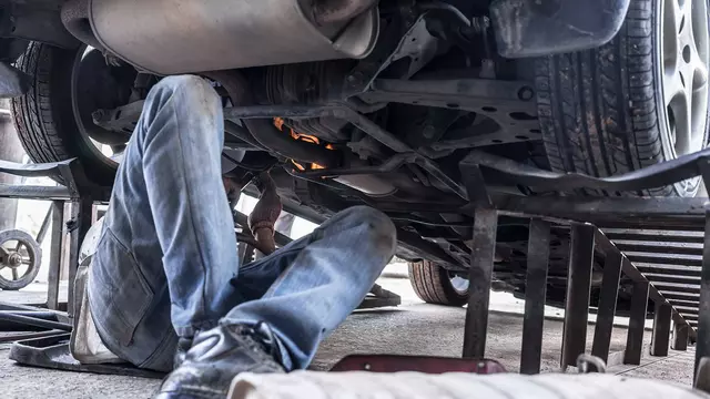 Car ramps being used by a mechanic