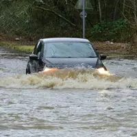 Floodwater bow wave car