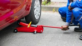 Car jack used to raise a car