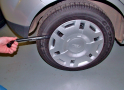 Remove the hub cap from the flat tyre, if fitted