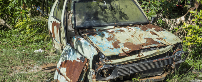 rusty car falling apart