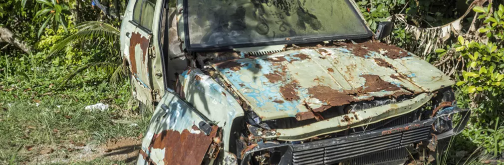 rusty car falling apart