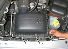 Release the spring clips along the edge of the housing and lift the air filter housing cover