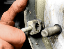 Remove the primary shoe holddown spring and pin…