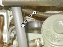 If the wear indicator has moved beyond the specified range, replace the drivebelt.