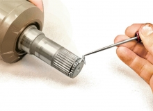 remove the spring clip with a pick, awl, or screwdriver