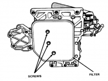The transmission filter on early models is held by three screws. On 5-speed NAG1 the filter pulls straight out.