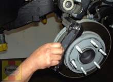 remove the outer brake pad