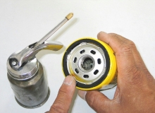 Lubricate the oil filter gasket with clean engine oil before installing the filter on the engine