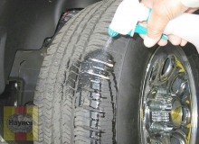 spray a soapy water solution onto the tread as the tire is turned slowly - leaks will cause small bubbles to appear