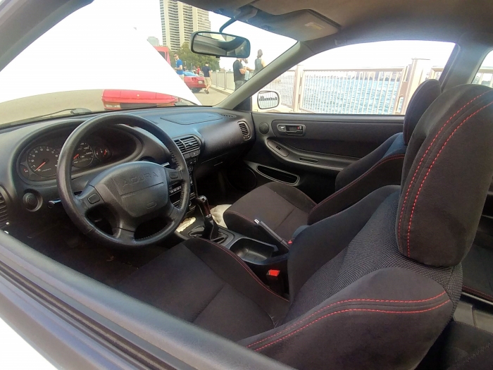 Grippy sport seats, precision shifter, and feedback galore from the wheel