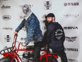 Masked Instagrammer and friend pose on the Coleman minibike red carpet